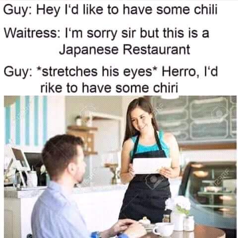 Man Making Racist Gesture in Japanese Restaurant